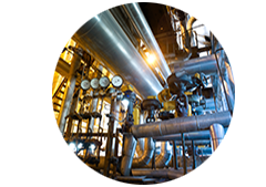 Close up of pipes and machines in a factory